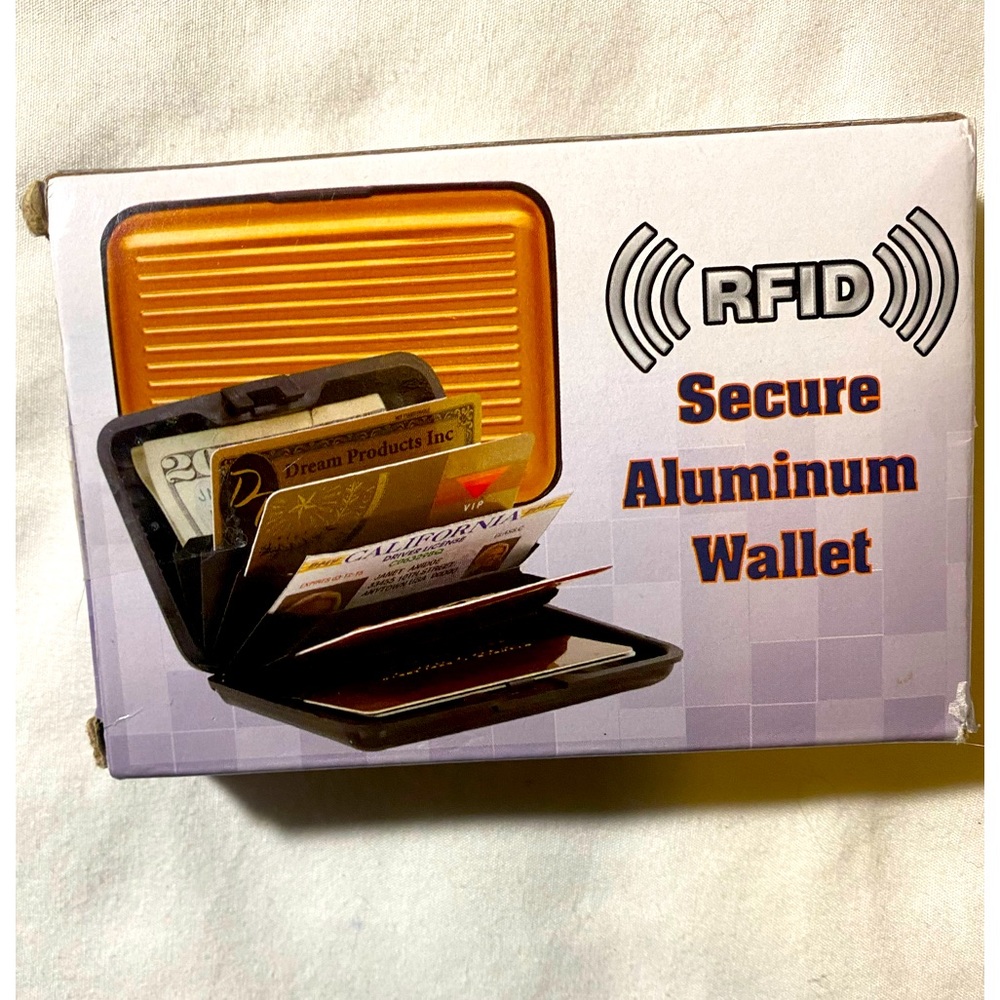 NIB RFID Card and ID holder, aluminum protection. Has many card slots and space